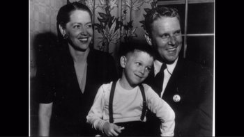 Movie still from “An Inconvenient Truth” (2006), directed by Davis Guggenheim – An old black and white photo of a man , woman , and a boy; Medium shot, High angle