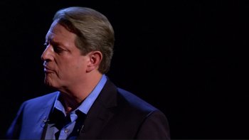 Movie still from “An Inconvenient Truth” (2006), directed by Davis Guggenheim – A person wearing a suit and tie; Close Up shot, Low angle
