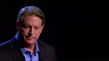 Movie still from “An Inconvenient Truth” (2006), directed by Davis Guggenheim – A person wearing a suit and tie; Close Up shot, Low angle