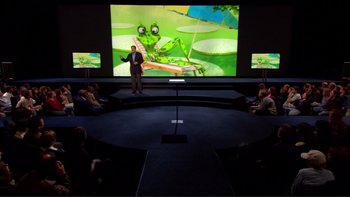 Movie still from “An Inconvenient Truth” (2006), directed by Davis Guggenheim – A man standing in front of a large screen; Wide shot, High angle