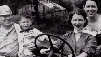 Movie still from “An Inconvenient Truth” (2006), directed by Davis Guggenheim – A young boy and a young girl sitting in a car; Medium shot, High angle