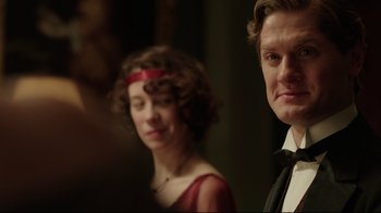 Movie still from “An Inspector Calls” (2015), directed by Raymond Pak-Ming Wong – A man and a woman standing next to each other; Close Up shot, Over the shoulder angle