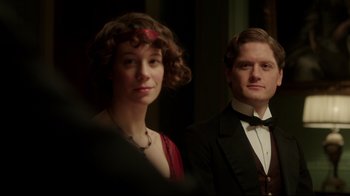 Movie still from “An Inspector Calls” (2015), directed by Raymond Pak-Ming Wong – A man and a woman dressed in formal wear; Close Up shot, Over the shoulder angle