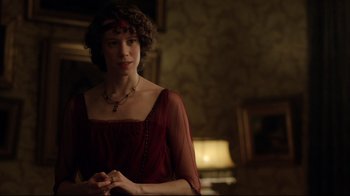 Movie still from “An Inspector Calls” (2015), directed by Raymond Pak-Ming Wong – A woman in a red dress standing in front of a lamp; Medium shot, Over the shoulder angle