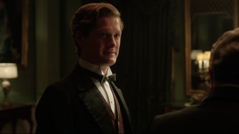 Movie still from “An Inspector Calls” (2015), directed by Raymond Pak-Ming Wong – A man in a suit and bow tie; Close Up shot, Over the shoulder angle