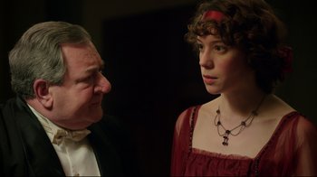 Movie still from “An Inspector Calls” (2015), directed by Raymond Pak-Ming Wong – A man and a woman standing next to each other; Close Up shot, Over the shoulder angle