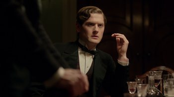 Movie still from “An Inspector Calls” (2015), directed by Raymond Pak-Ming Wong – A man in a tuxedo sitting in front of a mirror; Close Up shot, Over the shoulder angle