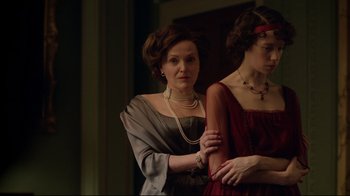 Movie still from “An Inspector Calls” (2015), directed by Raymond Pak-Ming Wong – A woman in a red dress and a woman in a red dress; Medium shot, Low angle