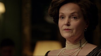 Movie still from “An Inspector Calls” (2015), directed by Raymond Pak-Ming Wong – An older woman wearing pearls and a black dress; Close Up shot, Over the shoulder angle