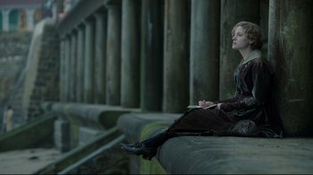 Movie still from “An Inspector Calls” (2015), directed by Raymond Pak-Ming Wong – A woman sitting on the edge of a bridge; Medium shot, High angle