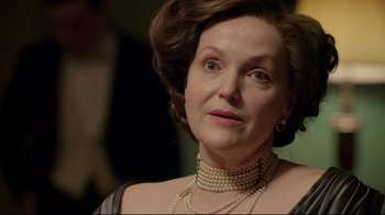 Movie still from “An Inspector Calls” (2015), directed by Raymond Pak-Ming Wong – An older woman wearing pearls and wearing a necklace; Close Up shot, Over the shoulder angle