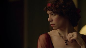 Movie still from “An Inspector Calls” (2015), directed by Raymond Pak-Ming Wong – A woman in a red dress looking to her left; Close Up shot, Low angle