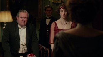Movie still from “An Inspector Calls” (2015), directed by Raymond Pak-Ming Wong – A man and a woman standing in front of another woman; Medium shot, Over the shoulder angle
