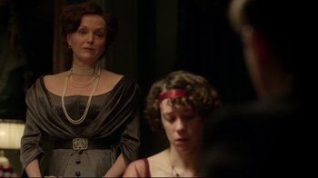 Movie still from “An Inspector Calls” (2015), directed by Raymond Pak-Ming Wong – A woman and a young girl in formal dress; Medium shot, Over the shoulder angle