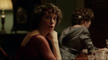Movie still from “An Inspector Calls” (2015), directed by Raymond Pak-Ming Wong – A woman with a red dress sitting in front of another woman; Close Up shot, Over the shoulder angle