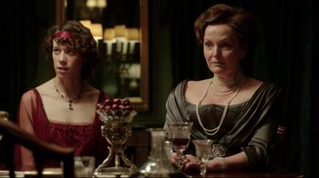 Movie still from “An Inspector Calls” (2015), directed by Raymond Pak-Ming Wong – Two women sitting at a table with a glass of red wine; Medium shot, Over the shoulder angle