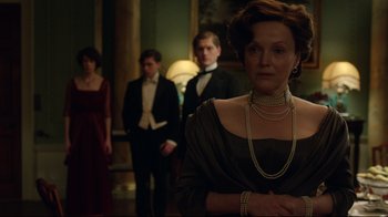 Movie still from “An Inspector Calls” (2015), directed by Raymond Pak-Ming Wong – A group of people standing in a room; Medium shot, Over the shoulder angle