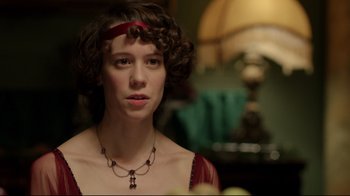 Movie still from “An Inspector Calls” (2015), directed by Raymond Pak-Ming Wong – A woman with a red ribbon around her neck; Close Up shot, Over the shoulder angle