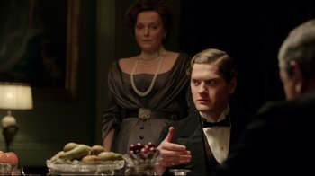 Movie still from “An Inspector Calls” (2015), directed by Raymond Pak-Ming Wong – A man and a woman sitting at a dinner table; Medium shot, Over the shoulder angle