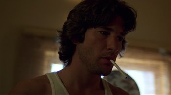 Movie still from “An Officer and a Gentleman” (1982), directed by Taylor Hackford – A person holding a cigarette in his mouth; Close Up shot, Low angle