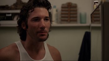 Movie still from “An Officer and a Gentleman” (1982), directed by Taylor Hackford – A person wearing a tank top; Close Up shot, Over the shoulder angle