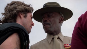 Movie still from “An Officer and a Gentleman” (1982), directed by Taylor Hackford – A man and a man in uniform talking to each other; Close Up shot, Low angle