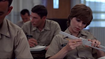 Movie still from “An Officer and a Gentleman” (1982), directed by Taylor Hackford – A man and a woman sitting at a table; Close Up shot, Low angle