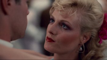 Movie still from “An Officer and a Gentleman” (1982), directed by Taylor Hackford – A person wearing a red lipstick; Close Up shot, Over the shoulder angle