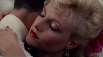 Movie still from “An Officer and a Gentleman” (1982), directed by Taylor Hackford – A person wearing a red lipstick; Close Up shot, Overhead angle