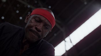 Movie still from “An Officer and a Gentleman” (1982), directed by Taylor Hackford – A person wearing a red head band; Close Up shot, Low angle