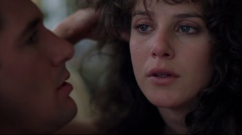 Movie still from “An Officer and a Gentleman” (1982), directed by Taylor Hackford – A person with her hand on her head; Close Up shot, Over the shoulder angle