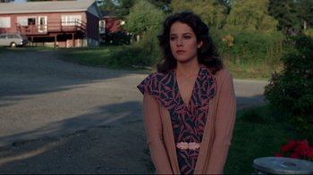 Movie still from “An Officer and a Gentleman” (1982), directed by Taylor Hackford – A young woman in a dress and a pink jacket; Medium shot, Over the shoulder angle