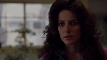 Movie still from “An Officer and a Gentleman” (1982), directed by Taylor Hackford – A person with long curly hair; Close Up shot, Over the shoulder angle