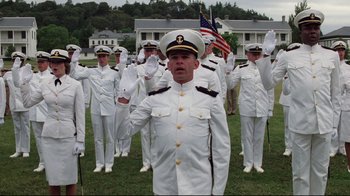 Movie still from “An Officer and a Gentleman” (1982), directed by Taylor Hackford – A group of men in white uniforms standing on a field; Wide shot, Low angle