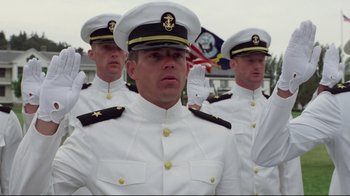 Movie still from “An Officer and a Gentleman” (1982), directed by Taylor Hackford – A group of men in white uniforms standing next to each other; Medium shot, Low angle