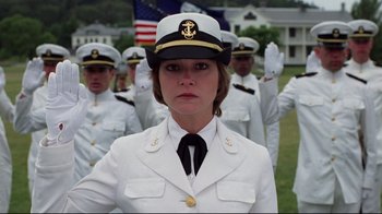 Movie still from “An Officer and a Gentleman” (1982), directed by Taylor Hackford – A group of people in uniform standing in a field; Medium shot, Low angle
