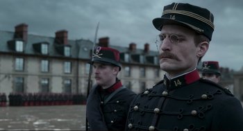 Movie still from “An Officer and a Spy” (2019), directed by Roman Polanski – A couple of men standing next to each other in uniforms; Close Up shot, Low angle