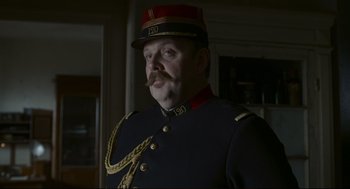 Movie still from “An Officer and a Spy” (2019), directed by Roman Polanski – A person wearing a uniform; Close Up shot, Low angle
