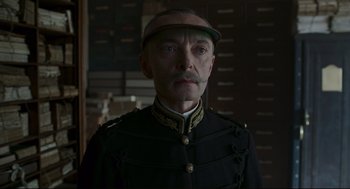 Movie still from “An Officer and a Spy” (2019), directed by Roman Polanski – A man wearing a uniform and a hat; Close Up shot, Low angle