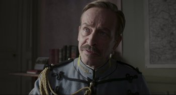 Movie still from “An Officer and a Spy” (2019), directed by Roman Polanski – A person wearing a uniform; Close Up shot, Low angle