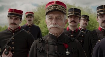 Movie still from “An Officer and a Spy” (2019), directed by Roman Polanski – A group of men in military uniforms standing next to each other; Close Up shot, Low angle