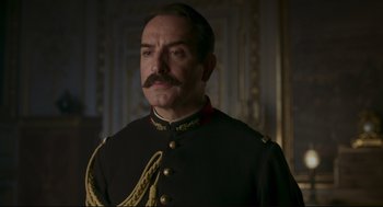 Movie still from “An Officer and a Spy” (2019), directed by Roman Polanski – A man in a military uniform with a mustache; Close Up shot, Low angle