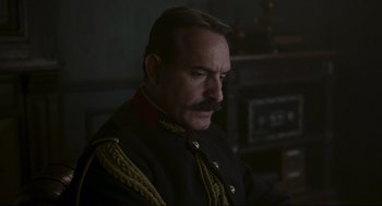 Movie still from “An Officer and a Spy” (2019), directed by Roman Polanski – A person wearing a uniform; Close Up shot, Low angle