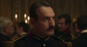 Movie still from “An Officer and a Spy” (2019), directed by Roman Polanski – A person wearing a military uniform; Close Up shot, Low angle