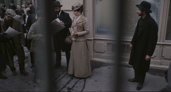 Movie still from “An Officer and a Spy” (2019), directed by Roman Polanski – A man and a woman dressed in period clothing; Wide shot, High angle
