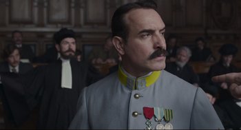 Movie still from “An Officer and a Spy” (2019), directed by Roman Polanski – A person wearing a uniform and medals; Close Up shot, Low angle