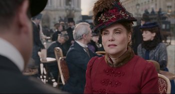 Movie still from “An Officer and a Spy” (2019), directed by Roman Polanski – A woman in a red coat and a hat; Close Up shot, Over the shoulder angle