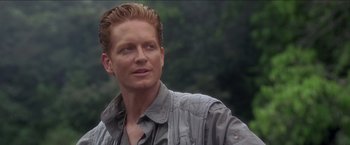 Movie still from “Anaconda” (1997), directed by Luis Llosa – A person wearing a jacket; Close Up shot, Over the shoulder angle