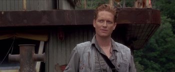 Movie still from “Anaconda” (1997), directed by Luis Llosa – A person wearing a jacket; Close Up shot, Over the shoulder angle