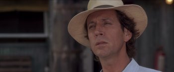 Movie still from “Anaconda” (1997), directed by Luis Llosa – A person wearing a hat; Close Up shot, Low angle